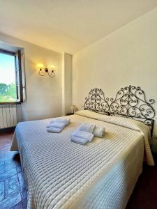 Postel nebo postele na pokoji v ubytování Fattoria Montignana