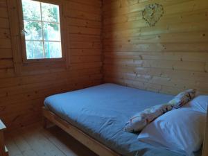 a room with a bed in a log cabin at Casa do Vale de Gondra in Castelo de Paiva +25 photos