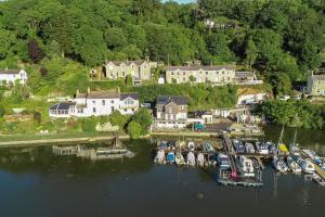 an aerial view of a marina with boats in the water at Waterfront House in Saint Clement