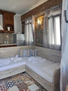 a bedroom with two large beds in a room at VILLA KALDERA in Skiathos Town