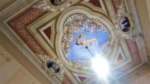 a painting on the ceiling of a building at Hotel Golfo Azzurro in Capoliveri