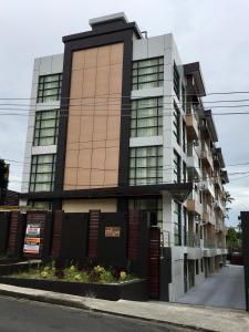 a tall building with a lot of windows at Bhan Towers Apartment in Suva