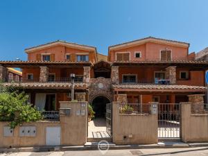 an old house with cardboard boxes in front of it at House Federica in Villasimius