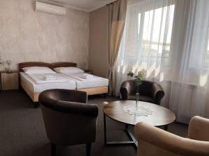 Postel nebo postele na pokoji v ubytování Noclegi-Restauracja Boss