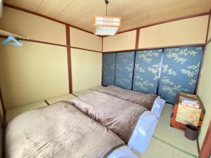 ゲストハウス山吹客房内的一张或多张床位