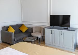a living room with a couch and a tv at FONTANA VERDE in Istanbul +23 photos
