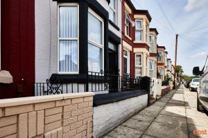 a row of houses on a city street at Host Liverpool - Spacious Family Home by Aintree, Parking in Aintree