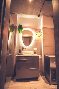 a bathroom with a sink and a mirror at THE LOFT - Wiślana 28 in Piotrków Trybunalski