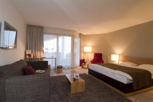Postelja oz. postelje v sobi nastanitve Hotel Schweizerhof Lenzerheide