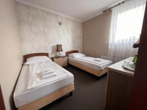 Postel nebo postele na pokoji v ubytování Noclegi-Restauracja Boss