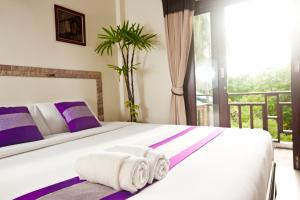 Postel nebo postele na pokoji v ubytování Shanti Boutique Hotel