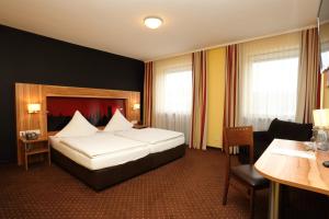 Postel nebo postele na pokoji v ubytování Hotel Silberhorn