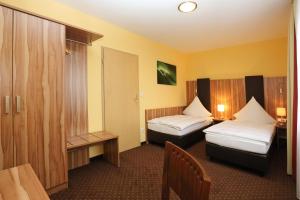 Postel nebo postele na pokoji v ubytování Hotel Silberhorn