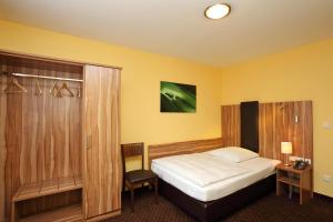 Postel nebo postele na pokoji v ubytování Hotel Silberhorn