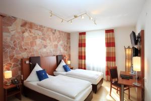 Postel nebo postele na pokoji v ubytování Hotel Silberhorn