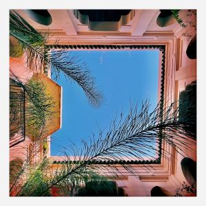 a mirror hanging on the side of a building at Palais Nejma oriental in Marrakesh