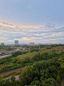 an aerial view of a city with trees and highways at 3R2B Entire Apartment Air-Conditioned by WNZ Home Putrajaya for Islamic Guests Only in Putrajaya