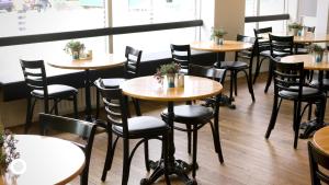 a row of tables and chairs in a restaurant at Center Hotels Klopp in Reykjavík