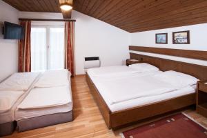 Postel nebo postele na pokoji v ubytování Gästehaus Sunkler