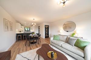 a living room with a couch and a table at At The Castle in Broughty Ferry