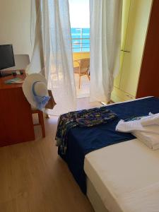 Postel nebo postele na pokoji v ubytování Hotel Panoramico