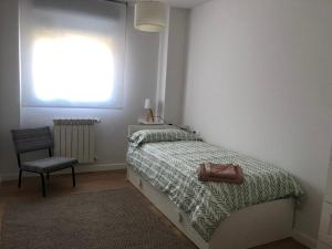 Postel nebo postele na pokoji v ubytování TÍA NANDUCA