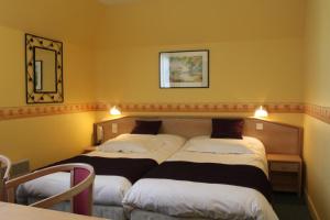 Postel nebo postele na pokoji v ubytování Hotel Des Bains