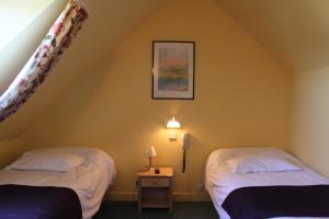 Postel nebo postele na pokoji v ubytování Hotel Des Bains