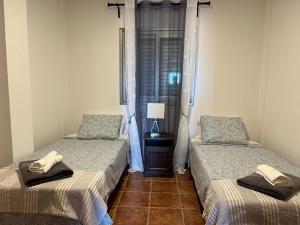 Postel nebo postele na pokoji v ubytování Apartamentos Vista Marina - El Médano + 37 fotografií