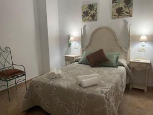 En eller flere senge i et værelse på Casa La Tinaja