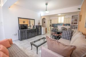 a living room with a couch and a table at Evangelia's Mansion in Naxos Chora