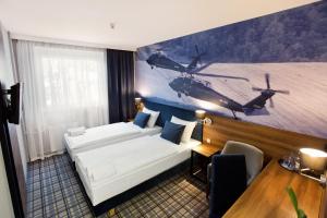 Łóżko lub łóżka w pokoju w obiekcie Hotel Polski