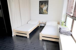 Posteľ alebo postele v izbe v ubytovaní Przestronny apartament w centrum Poznania - Stare miasto