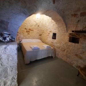 Letto o letti in una camera di TRULLO PIETRAPOESIA