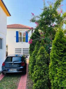 a car parked in the driveway of a house at Studio Apartment 21 in Danilovgrad