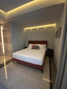 A bed or beds in a room at NoOne Tropea Guesthouse