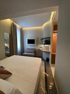A bed or beds in a room at NoOne Tropea Guesthouse