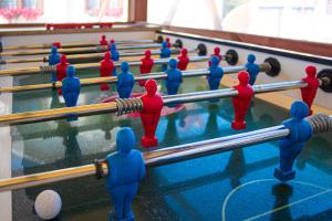 a group of people playing a game of billiard at Domki i Apartamenty Al Mare in Sianozety