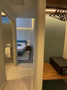 A bed or beds in a room at NoOne Tropea Guesthouse