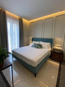 A bed or beds in a room at NoOne Tropea Guesthouse