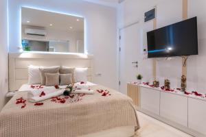 Llit o llits en una habitació de Alex Central Apartments