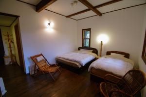 מיטה או מיטות בחדר ב-Tombouctou
