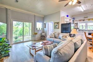a living room with a couch and a table at Secluded Weatherford Cottage with Outdoor Pool! in Willow Park