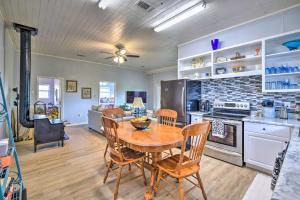 a kitchen and dining room with a table and chairs at Secluded Weatherford Cottage with Outdoor Pool! in Willow Park
