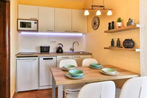 Kuchyň nebo kuchyňský kout v ubytování daMonte – Apartments and rooms
