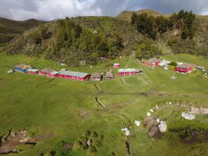 an aerial view of a farm on a hill at Hacienda Yanahurco in Del Salitre