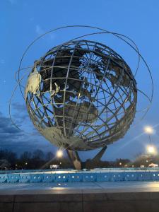 a large sculpture of a globe on a sidewalk at Separate big room near JFK and LaGuardia airport in Flushing
