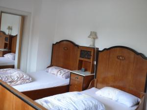 En eller flere senger på et rom på Apartments Weisser Reiter
