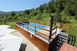 a swimming pool on top of a house at House Breza in Kuterevo