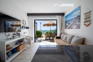 a living room with a view of the ocean at Apartamentos Playa Feliz in Playa del Ingles